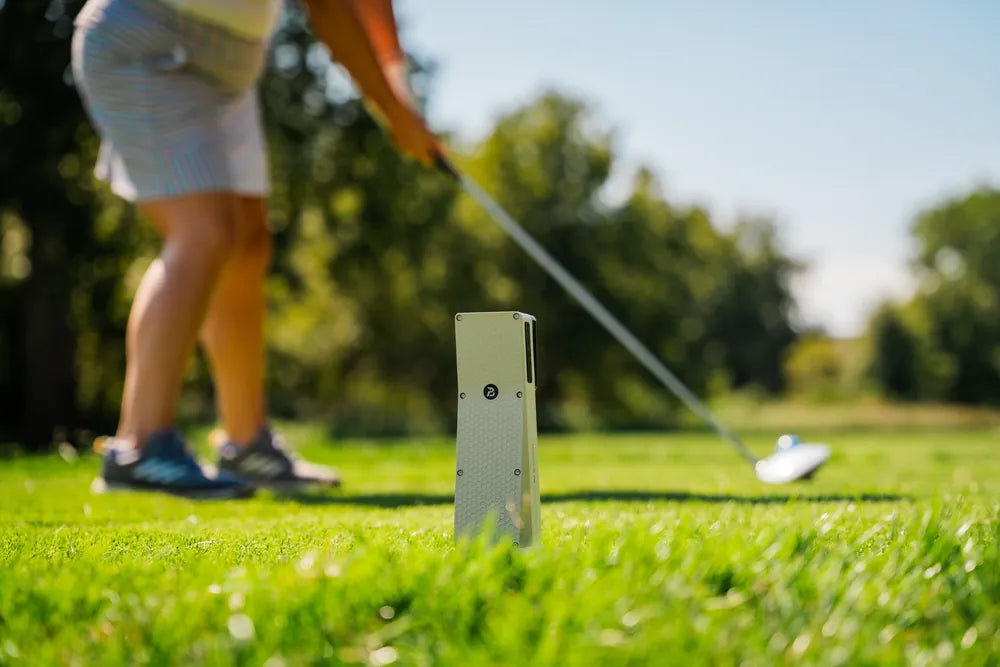 Golfer addressing a driver with the X10 behind him
